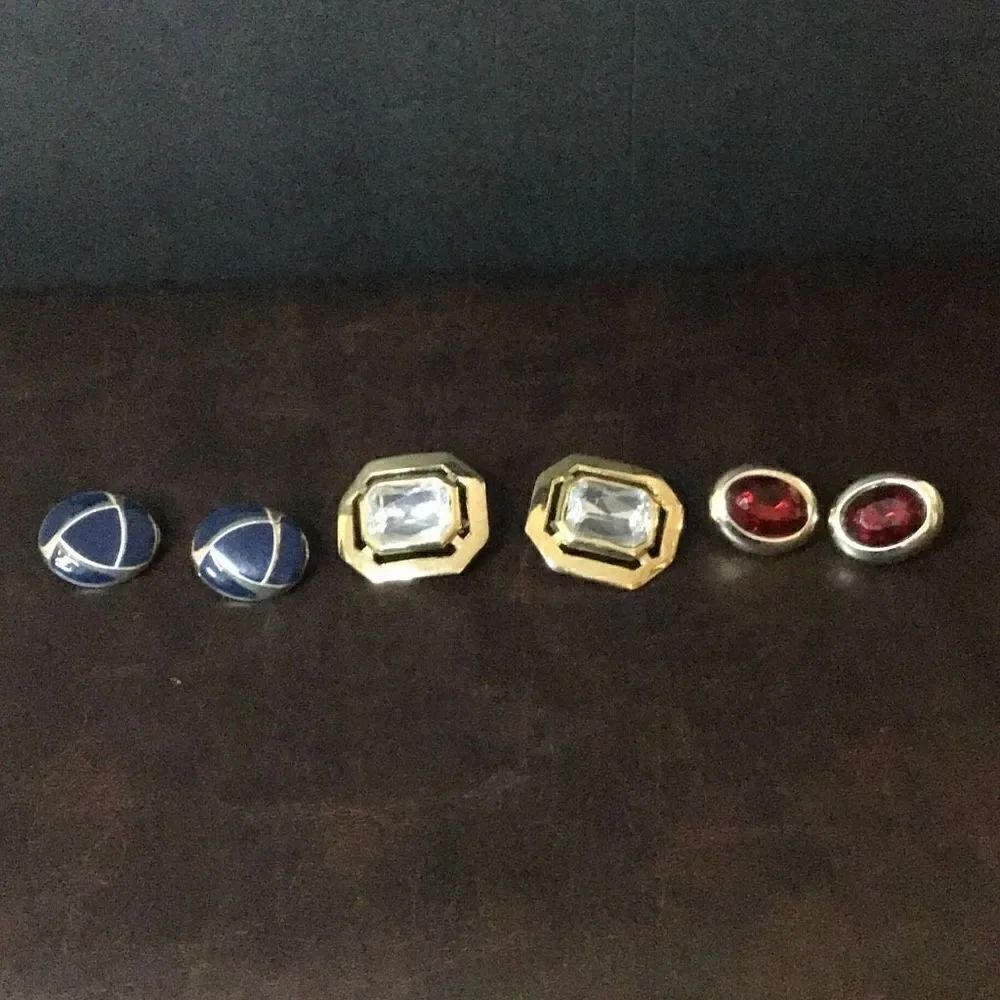 Three pair of various colored Clip on earrings
